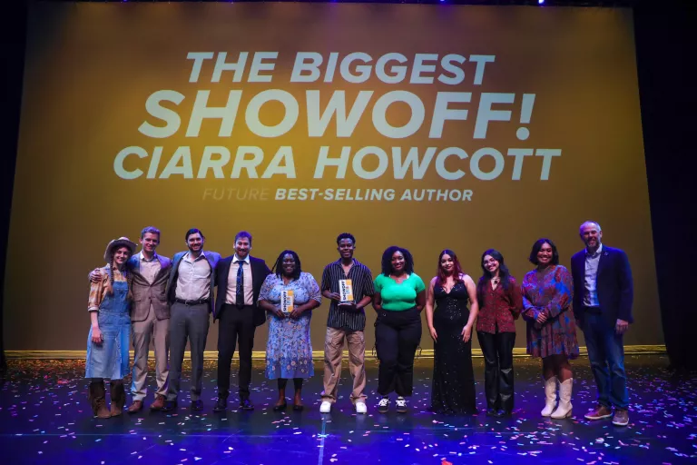 Image features all ten contestants at the MTC Showoff accompanied by MTC President Dr. Greg Little and text on the screen above their heads that reads: The Biggest Showoff! Ciarra Howcott Future Best-Selling Author